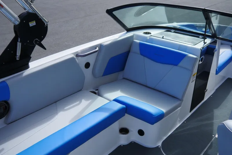 Slide: The Image of 2020 MasterCraft NXT22 boat interior with blue and gray seating, sleek design. - 11
