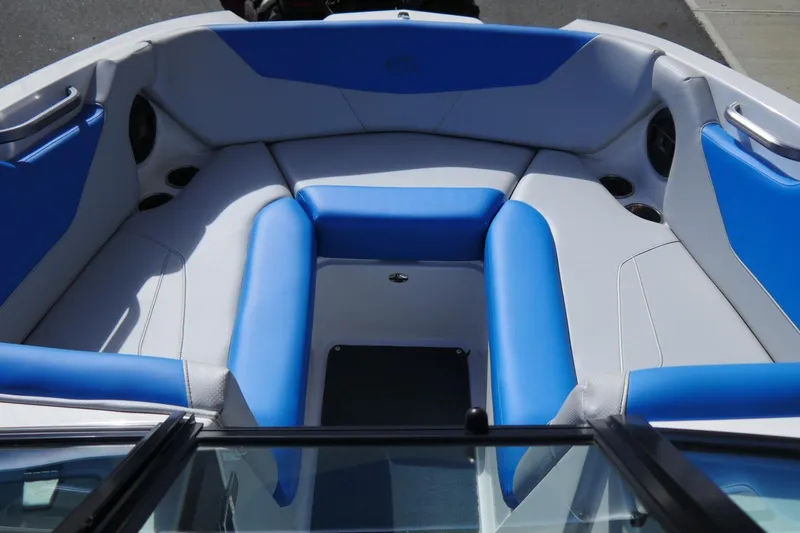 Slide: The Image of 2020 MasterCraft NXT22 boat interior with blue and gray seating. - 14
