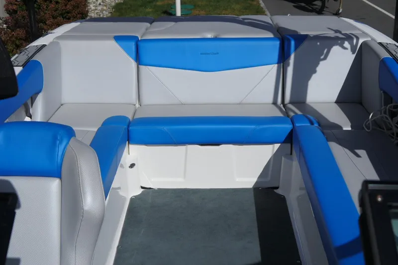 Slide: The Image of 2020 MasterCraft NXT22 boat interior with blue and gray seating. - 15