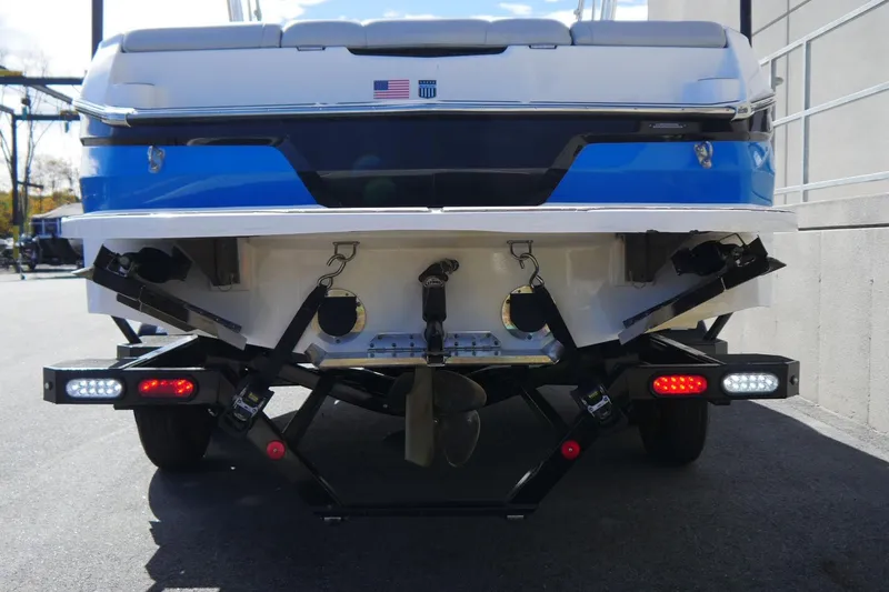 Slide: The Image of Rear view of a 2020 MasterCraft NXT22 boat on a trailer. - 6