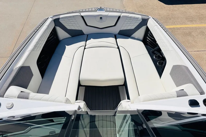 Slide: The Image of 2023 Nautique Super Air Nautique G25 boat interior with luxurious seating and modern design. - 11