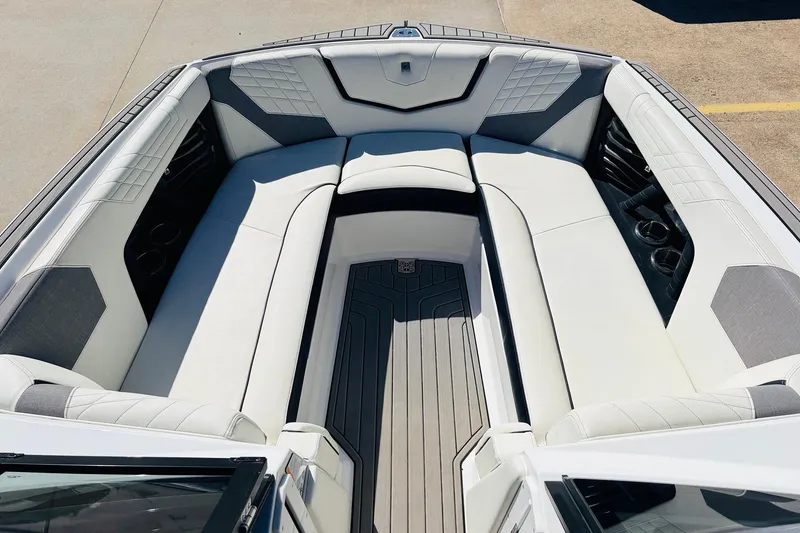 Slide: The Image of 2023 Nautique Super Air Nautique G25 boat interior with luxurious seating and modern design. - 14