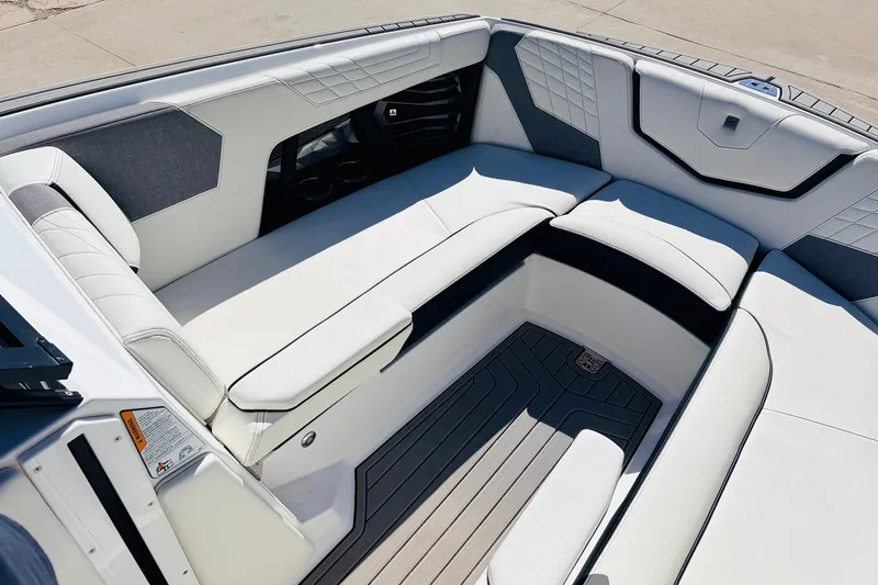 Slide: The Image of 2023 Nautique Super Air Nautique G25 interior with luxurious seating and modern design. - 15