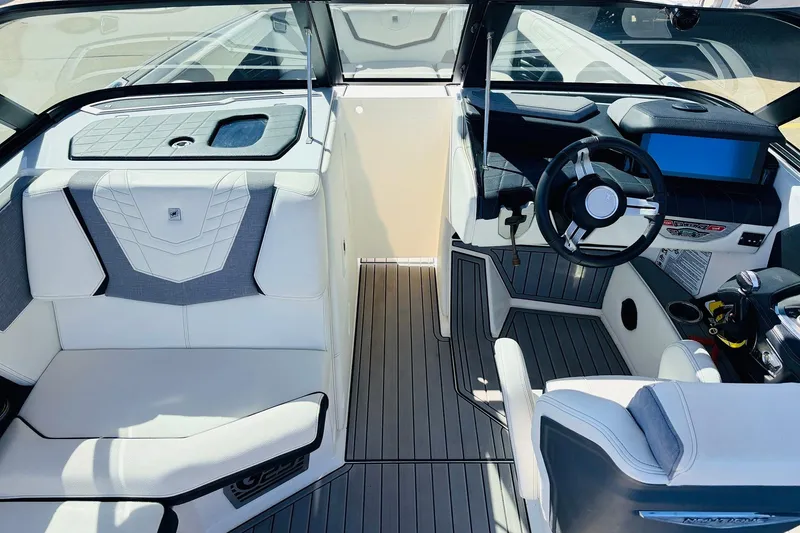 Slide: The Image of 2023 Nautique Super Air Nautique G25 interior with sleek seating and modern dashboard design. - 21