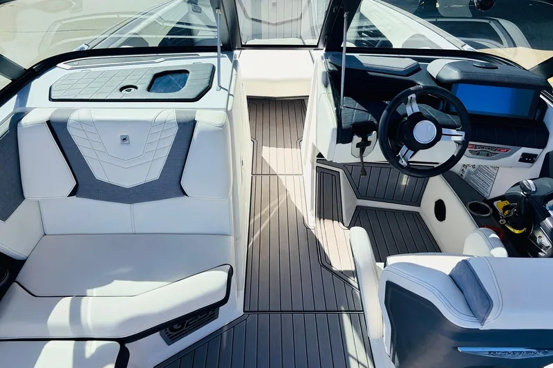 Slide: The Image of 2023 Nautique Super Air Nautique G25 interior with sleek design and modern dashboard. - 22