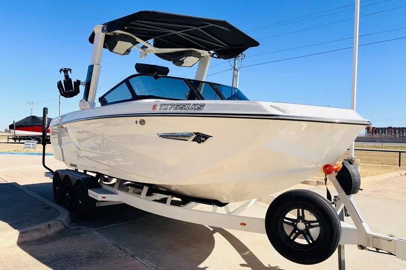 Slide: The Image of 2023 Nautique Super Air Nautique G25 boat on trailer, parked outdoors. - 3