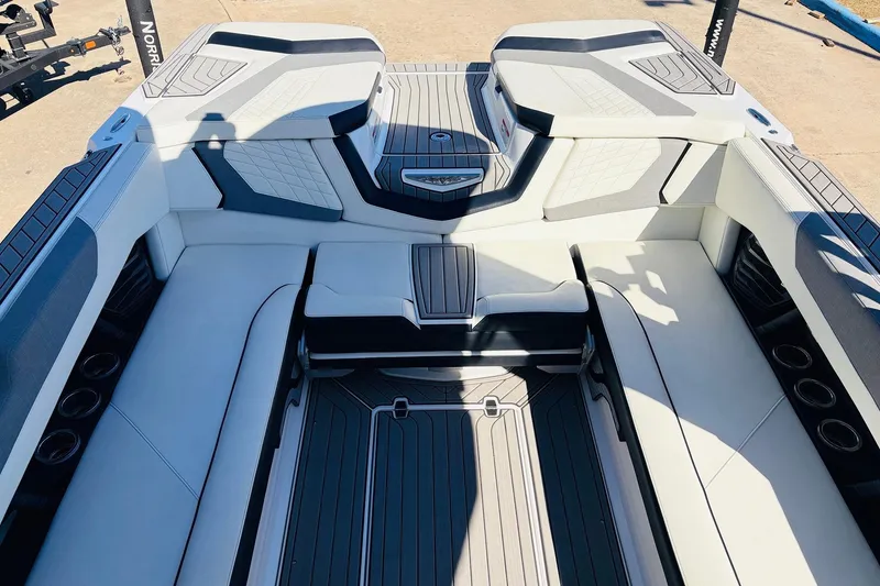 Slide: The Image of 2023 Nautique Super Air Nautique G25 interior with luxurious seating and modern design. - 34