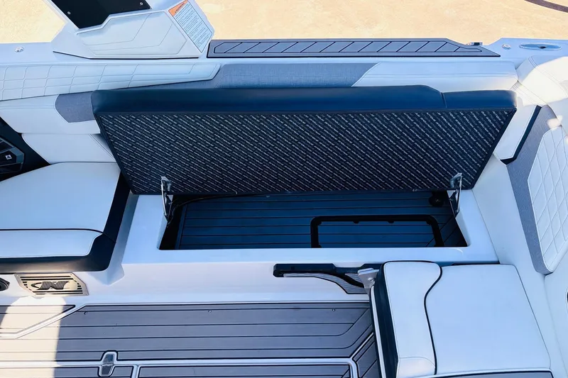 Slide: The Image of 2023 Nautique Super Air Nautique G25 interior storage compartment with sleek seating design. - 42
