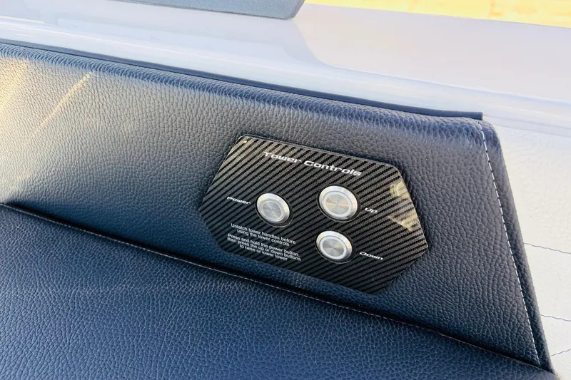 Slide: The Image of 2023 Nautique Super Air Nautique G25 tower controls on black leather panel. - 47