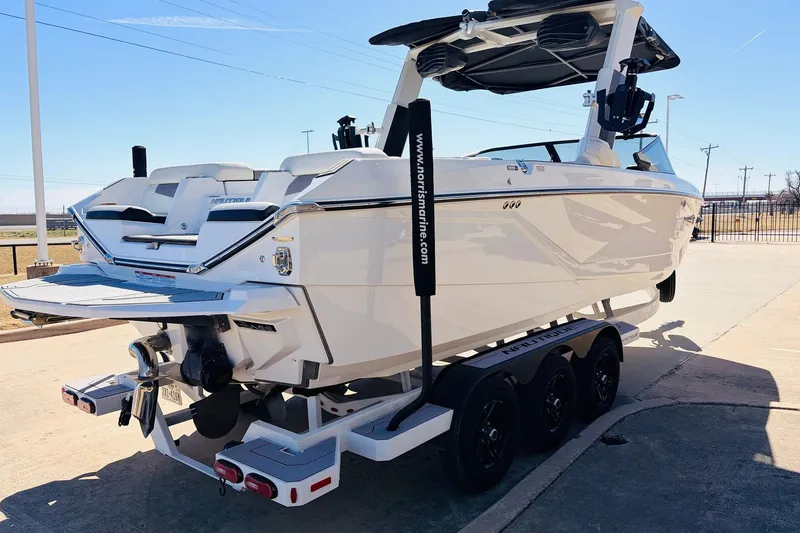 Slide: The Image of 2023 Nautique Super Air Nautique G25 boat on trailer, rear view in sunlight. - 5