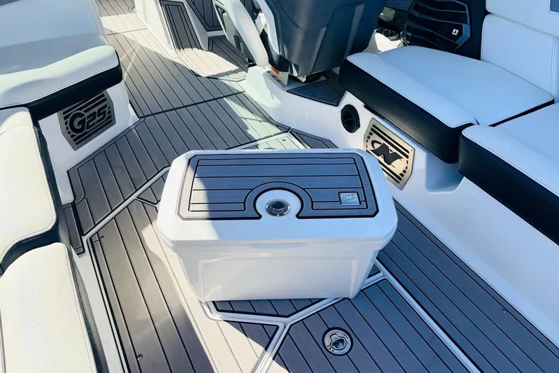 Slide: The Image of 2023 Nautique Super Air Nautique G25 interior with sleek seating and modern flooring design. - 50
