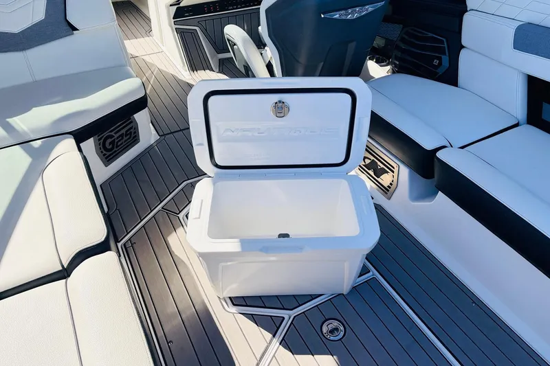 Slide: The Image of 2023 Nautique Super Air Nautique G25 interior with open cooler on deck. - 51