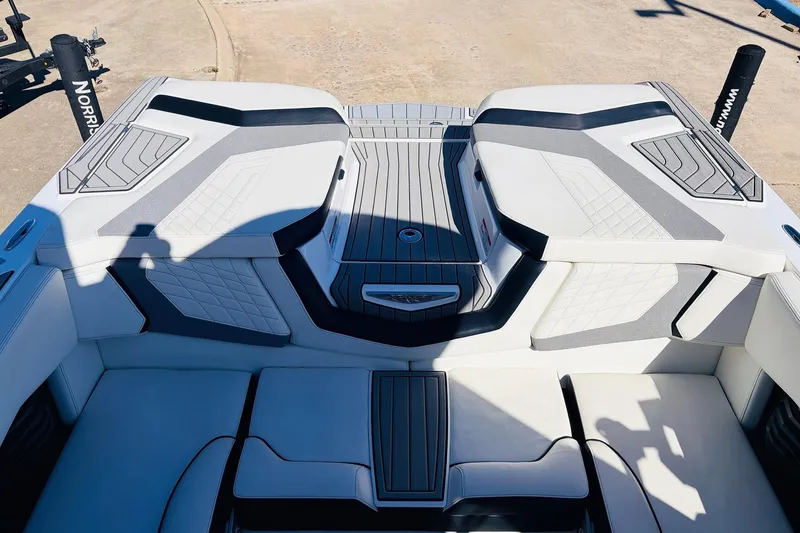 Slide: The Image of 2023 Nautique Super Air Nautique G25 boat interior with sleek seating and modern design. - 53