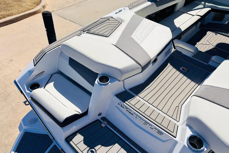 Slide: The Image of 2023 Nautique Super Air Nautique G25 boat interior with sleek seating and modern design. - 60