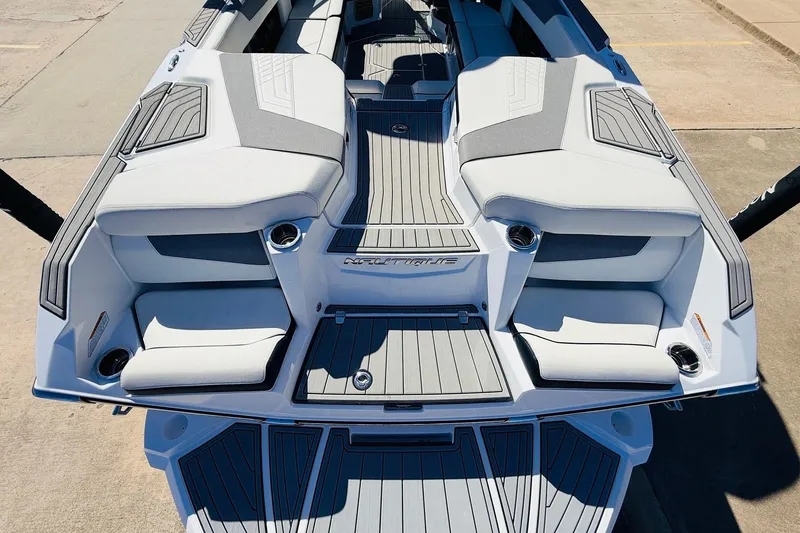Slide: The Image of 2023 Nautique Super Air Nautique G25 boat interior with sleek seating and modern design. - 62