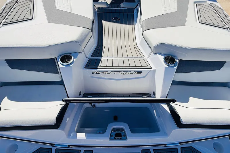 Slide: The Image of 2023 Nautique Super Air Nautique G25 boat interior, featuring sleek seating and modern design. - 63