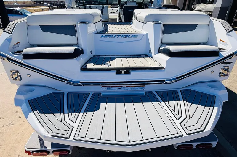 Slide: The Image of 2023 Nautique Super Air Nautique G25 boat, rear view with seating and deck. - 64