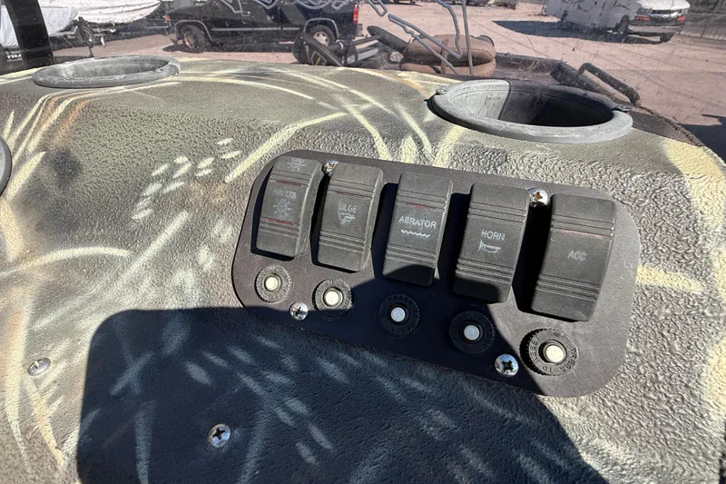 Slide: The Image of Control panel of 2018 Excel F86 boat with switches for lights, bilge, aerator, horn, and accessories. - 13