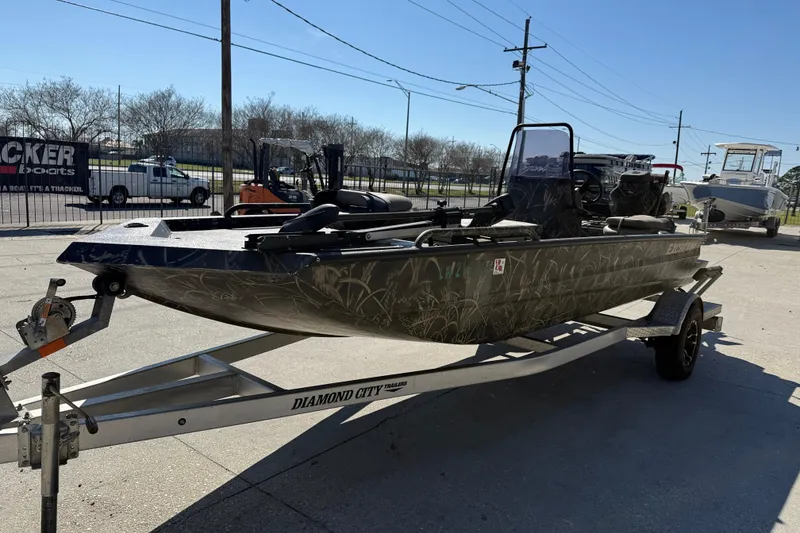 Slide: The Image of 2018 Excel F86 boat on trailer, parked outdoors in a dealership lot. - 3