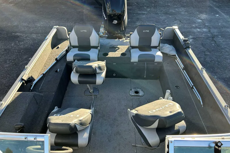 Slide: The Image of 2012 Lund 1775 Impact XS boat interior with seating and storage compartments. - 7