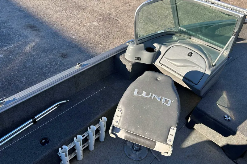 Slide: The Image of 2012 Lund 1775 Impact XS boat interior with windshield and seating. - 8