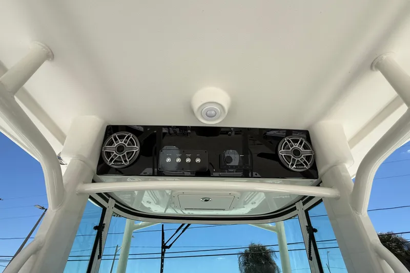 Slide: The Image of 2026 World Cat 325 CC boat interior with speakers and control panel. - 17