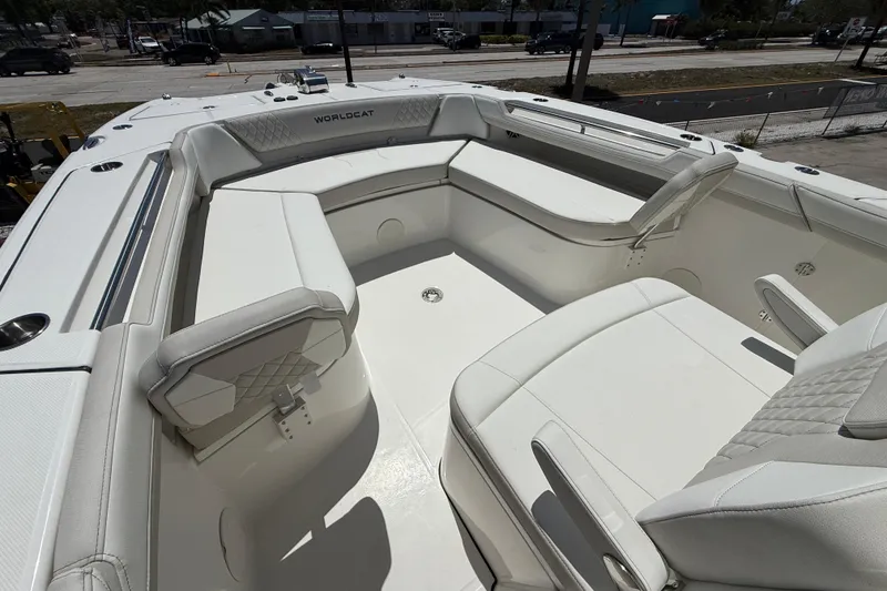 Slide: The Image of 2026 World Cat 325 CC boat interior with luxurious white seating and modern design. - 18