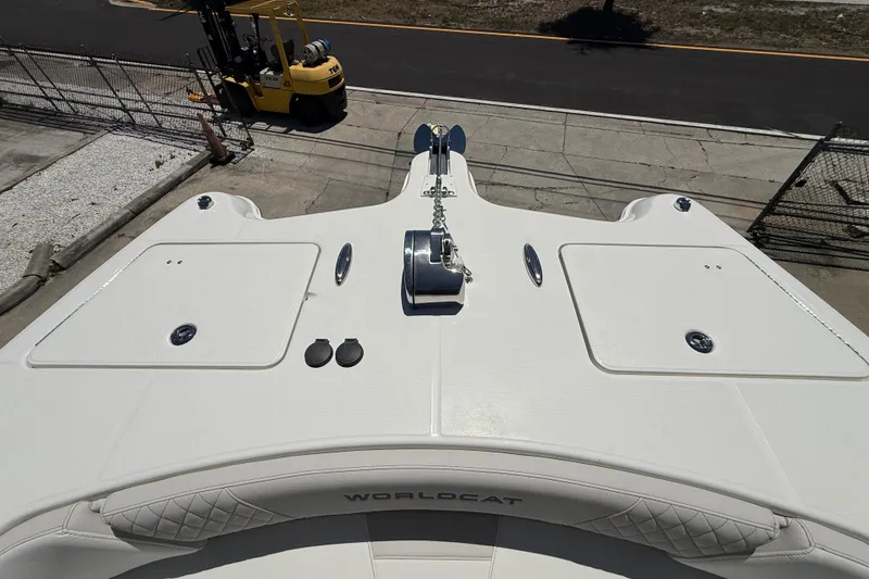 Slide: The Image of 2026 World Cat 325 CC boat deck with anchor and storage compartments. - 19