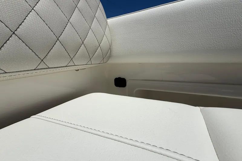 Slide: The Image of Luxurious white seating detail on 2026 World Cat 325 CC boat. - 28