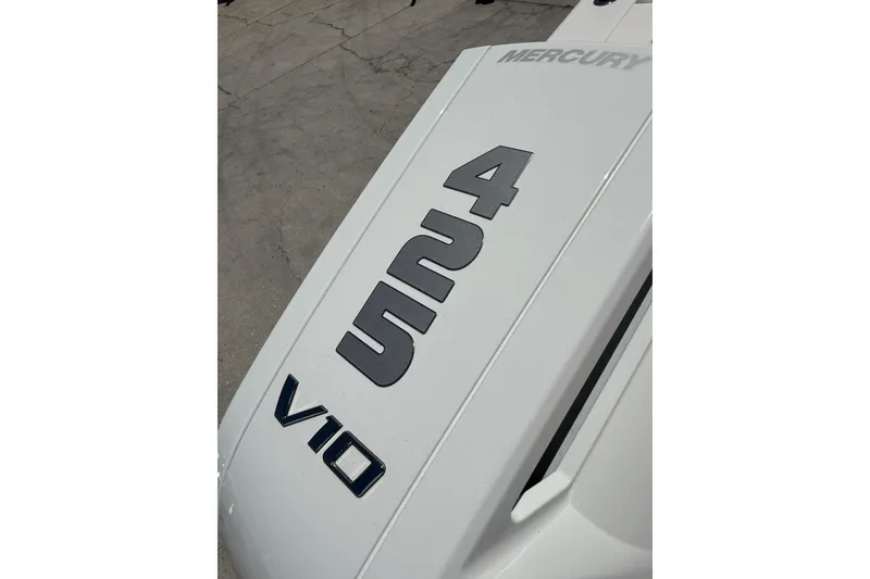 Slide: The Image of 2026 World Cat 325 CC boat with Mercury V10 engine branding. - 29