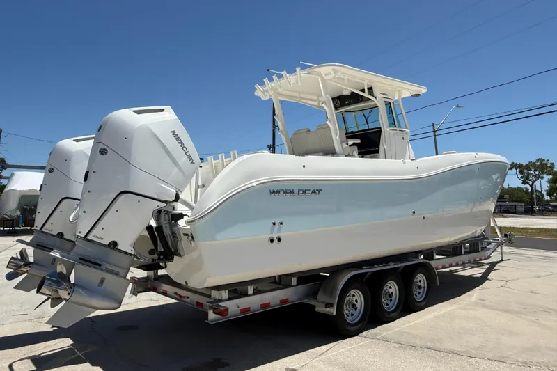 Slide: The Image of 2026 World Cat 325 CC boat on trailer with dual Mercury outboard engines. - 5