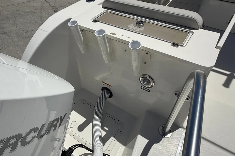 Slide: The Image of 2026 World Cat 325 CC boat interior with Mercury engine and fresh water access. - 7