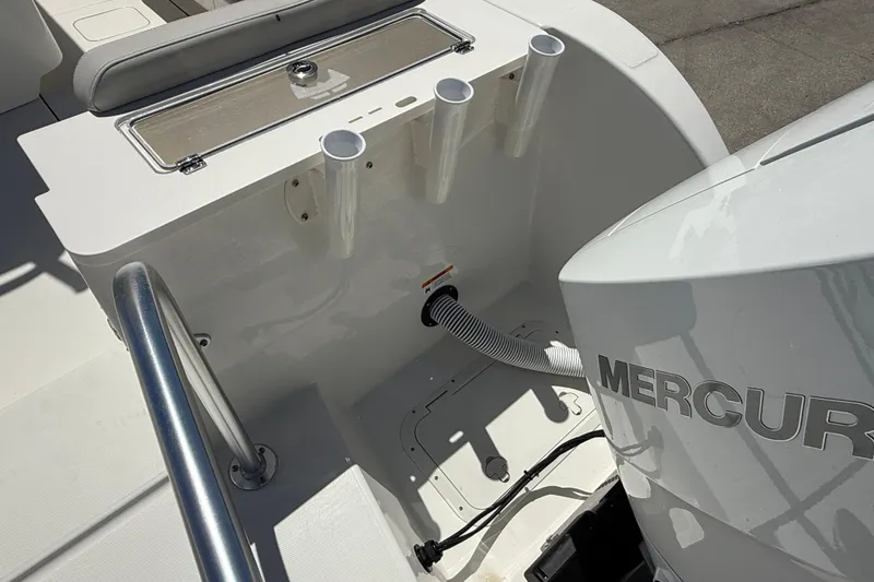 Slide: The Image of 2026 World Cat 325 CC boat with Mercury engine and rod holders. - 8