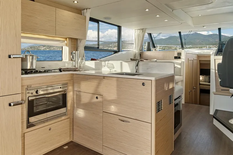 Slide: The Image of Manufacturer Provided Image: Modern kitchen interior of 2026 Beneteau Swift Trawler 48 with ocean view. - 6