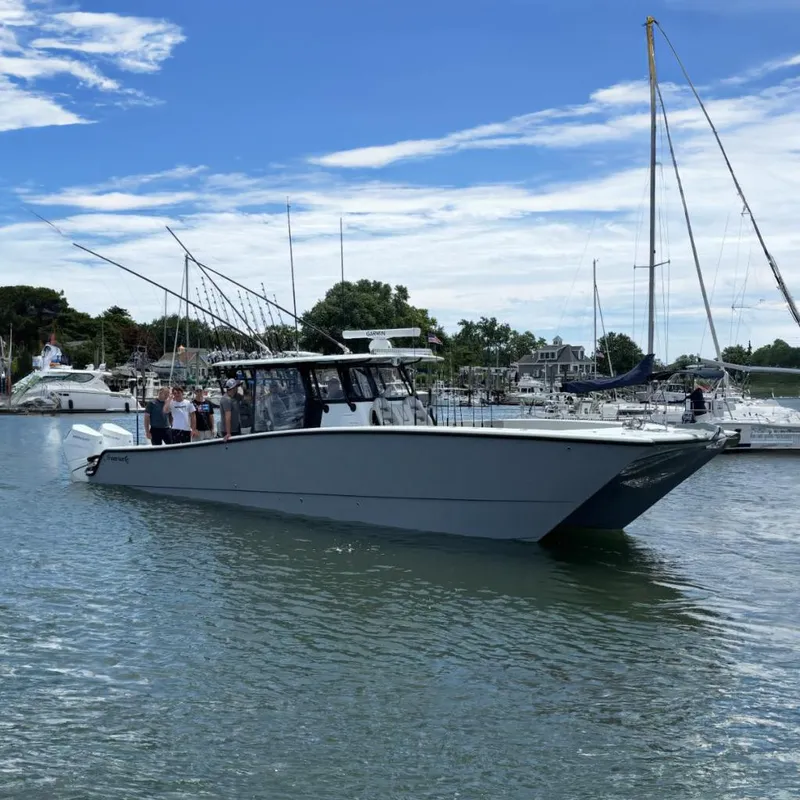 The Image of Freeman 42LR 2024 boat in harbor with fishing rods. - 0