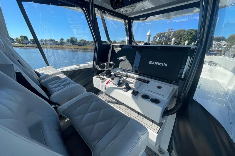 Slide: The Image of Interior of 2024 Freeman 42LR boat with Garmin navigation system and luxurious seating. - 4