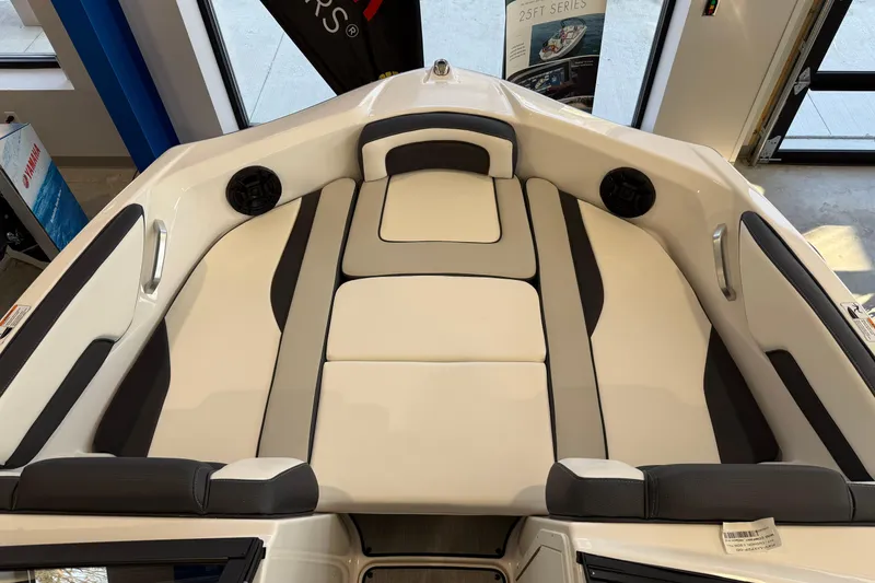 Slide: The Image of 2025 Yamaha Boats AR195 interior with cushioned seating and sleek design. - 4