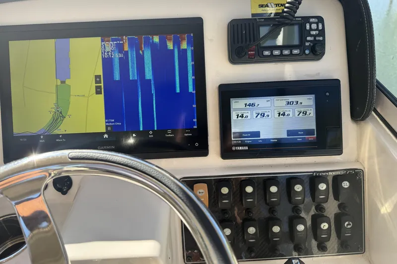 Slide: The Image of Close-up of Yamaha F200XCA engine on 2022 Grady-White Freedom 275 boat. - 14