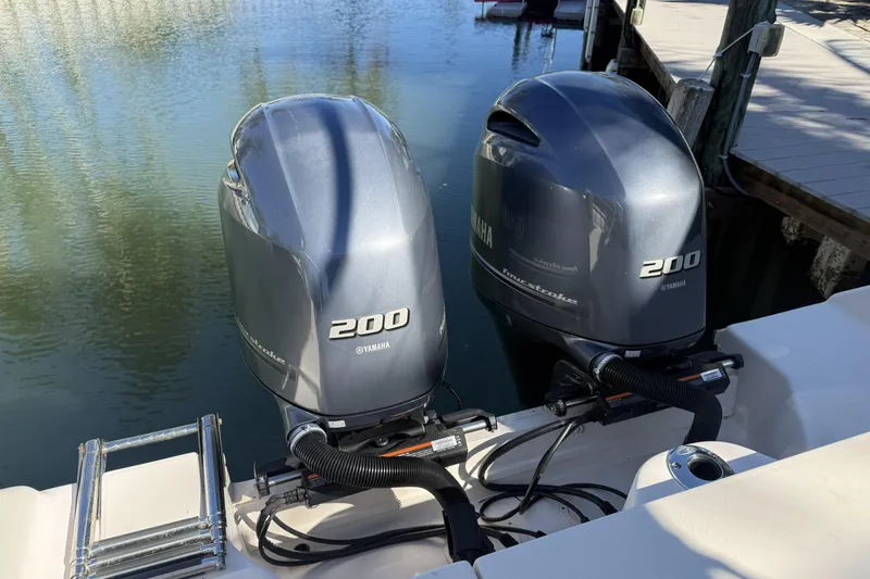 Slide: The Image of Twin Yamaha 200 outboard engines on a 2022 Grady-White Freedom 275 boat. - 30