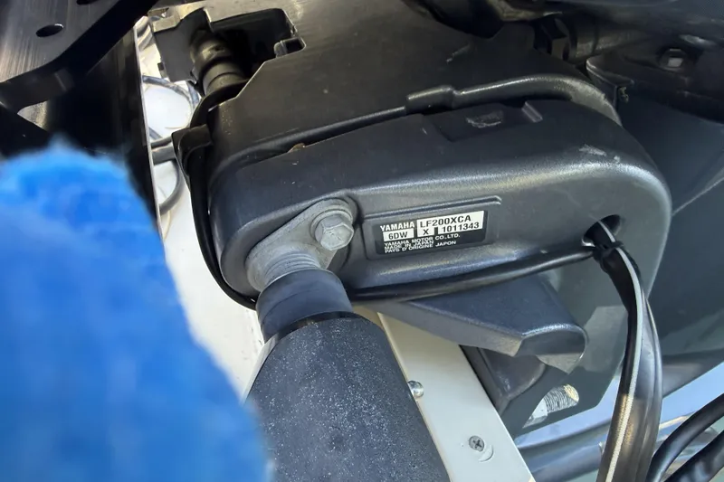 Slide: The Image of 2022 Grady-White Freedom 275 boat cruising near tropical island with palm trees. - 7