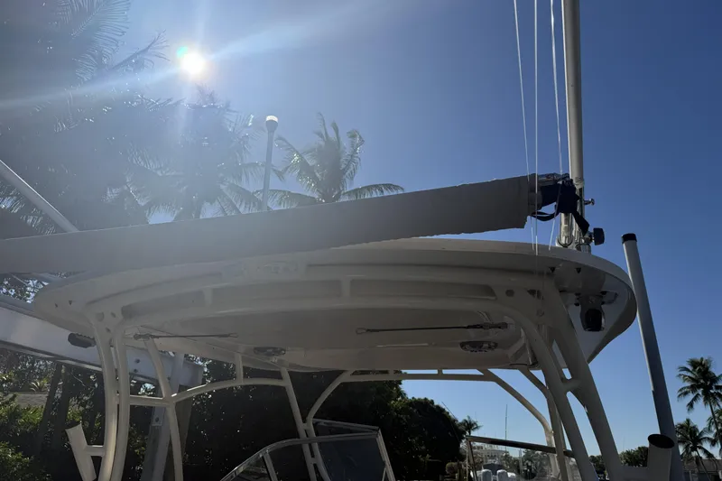 Slide: The Image of 2022 Grady-White Freedom 275 boat docked in a marina, showcasing sleek design and modern features. - 9