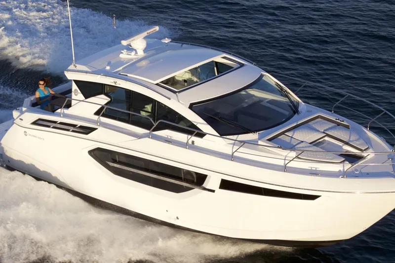 The Image of 2023 Cruisers 42 Cantius yacht cruising on open water, side view. - 1