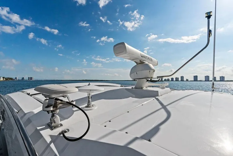 Slide: The Image of 2023 Cruisers 42 Cantius yacht with Garmin radar, ocean view, and city skyline. - 15