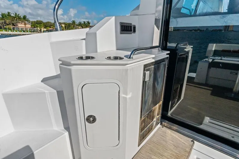 Slide: The Image of Outdoor kitchenette on 2023 Cruisers 42 Cantius yacht with ocean view. - 16