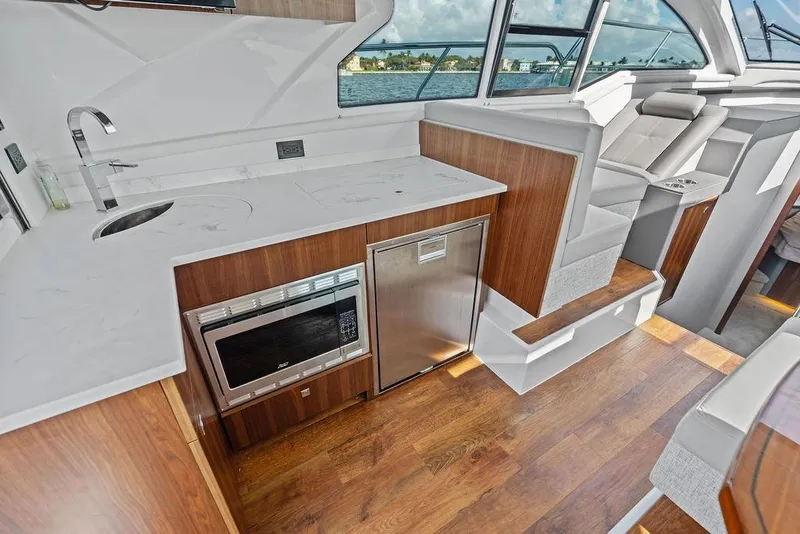 Slide: The Image of Luxurious interior of 2023 Cruisers 42 Cantius yacht with modern kitchen amenities. - 26