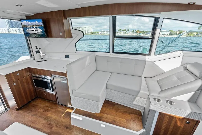 Slide: The Image of Luxurious interior of 2023 Cruisers 42 Cantius yacht with modern kitchen and seating area. - 27