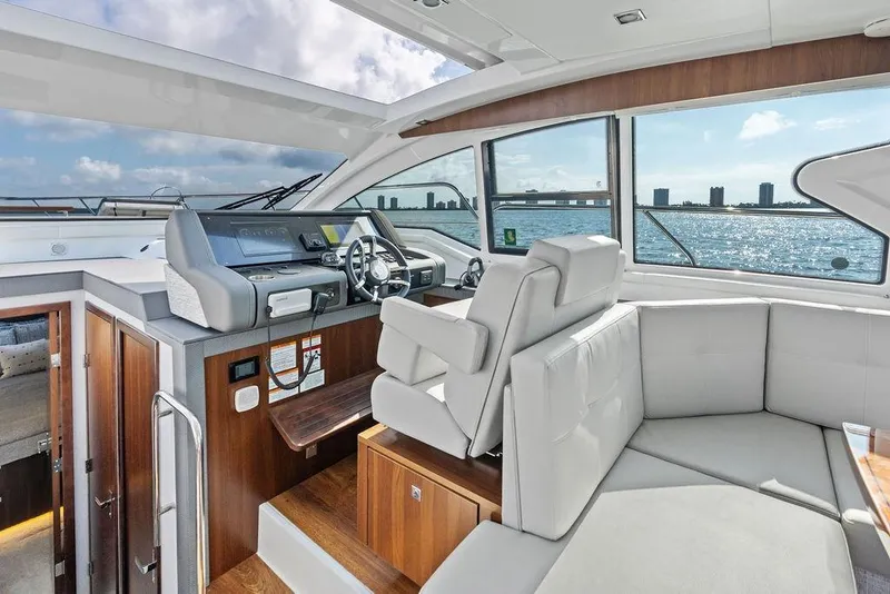 Slide: The Image of Luxurious interior of 2023 Cruisers 42 Cantius yacht with modern helm and seating. - 29