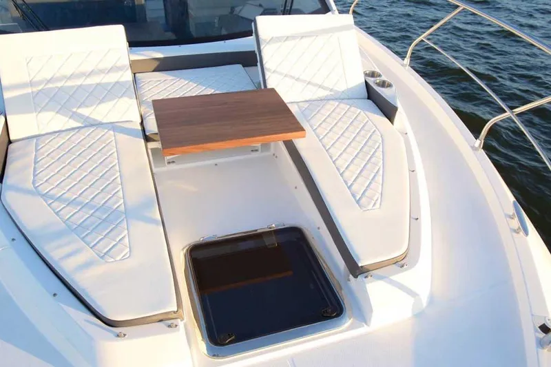 Slide: The Image of Luxurious 2023 Cruisers 42 Cantius yacht deck with elegant seating and table. - 3