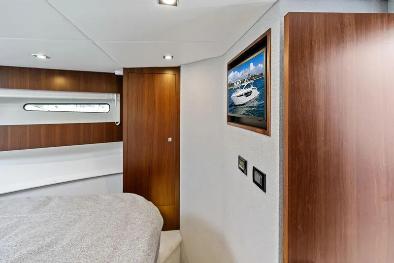 Slide: The Image of Luxurious interior of 2023 Cruisers 42 Cantius yacht with wood paneling and modern decor. - 38