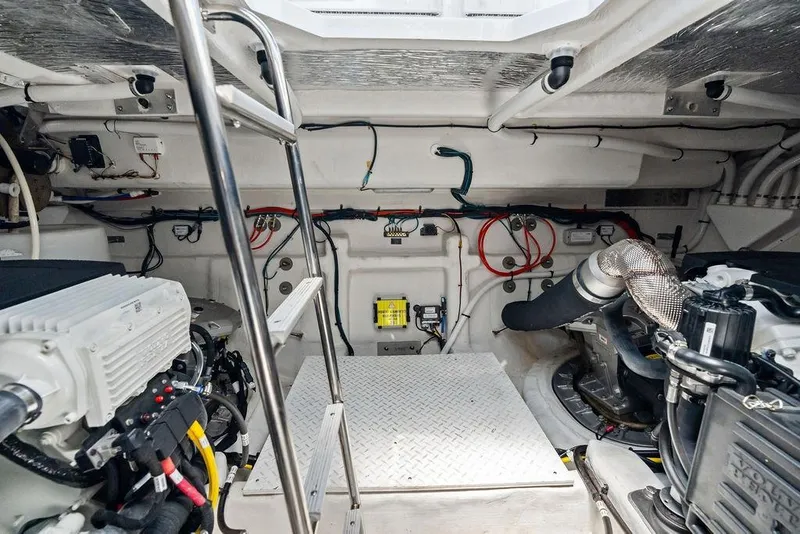 Slide: The Image of Engine room of 2023 Cruisers 42 Cantius yacht, featuring modern equipment and wiring. - 49
